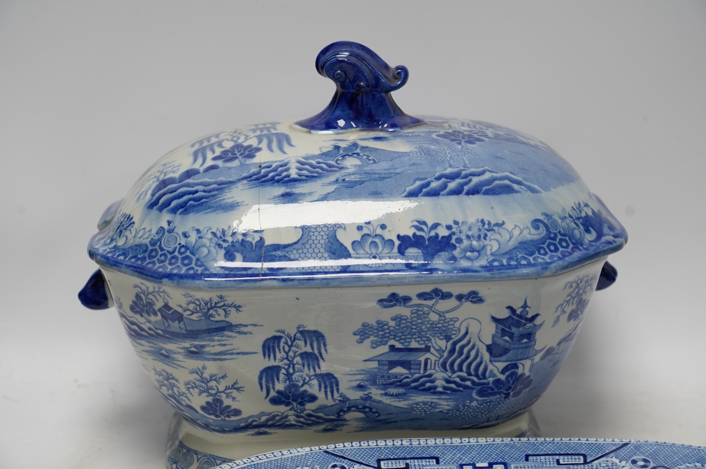 A Victorian Staffordshire blue and white pottery soup tureen and cover, together with a meat dish (2). Condition - tureen cover cracked